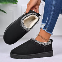 Black platform ankle boots with patterned collar, stitched edge, and fleece lining