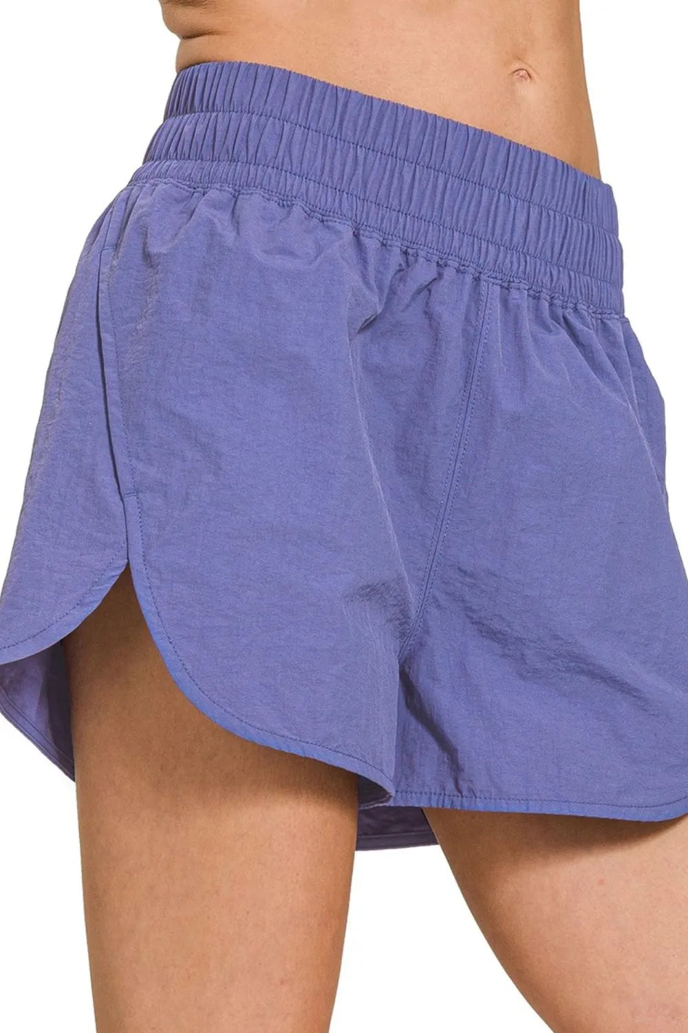 Light blue running shorts with elastic smocked waist and side hem vents