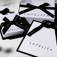 Bracelet gift packaging with LATE LITA branded boxes and black ribbon bows