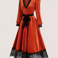 Orange-red velvet V-neck midi dress, black lace cuffs and hem, waist tie bow, back view