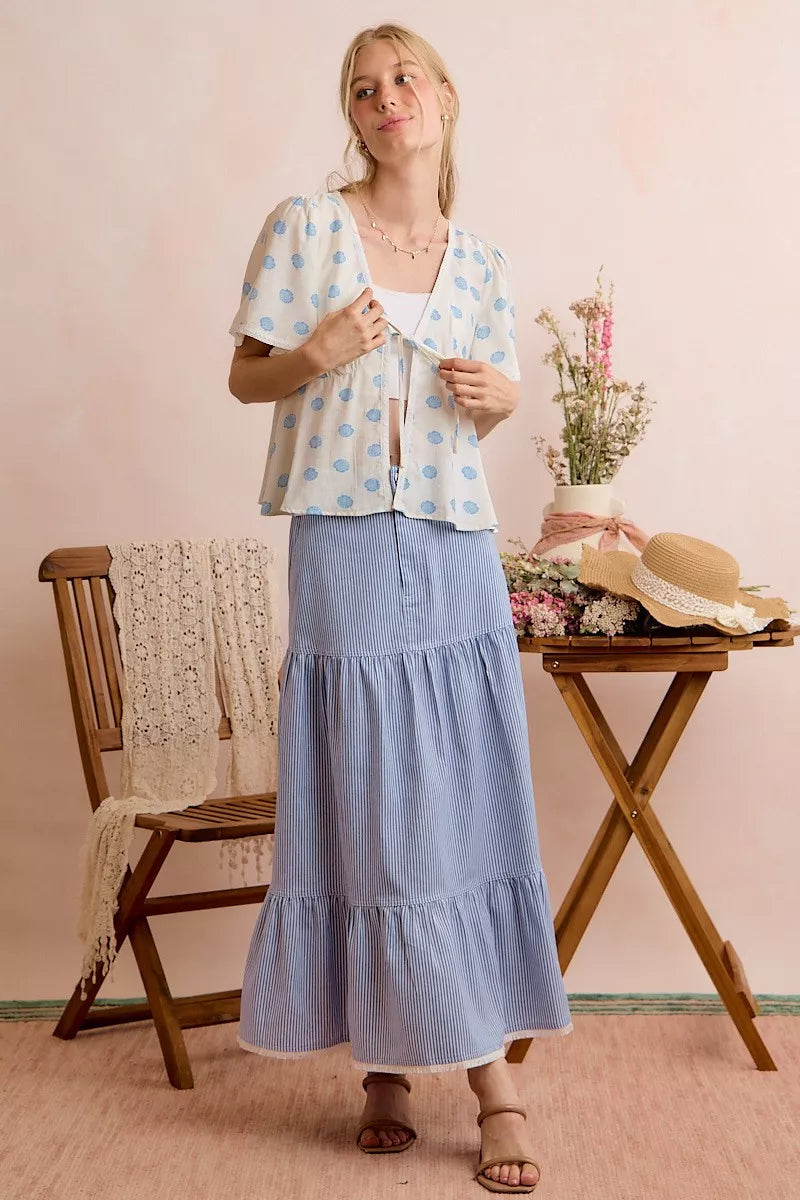 Ivory blouse top with blue shell print and ribbon tie at center front