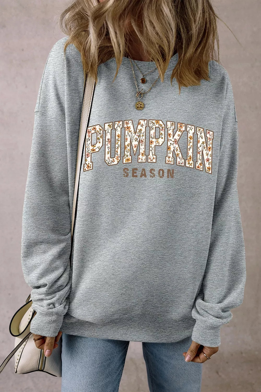 Gray oversized pullover sweatshirt with “PUMPKIN SEASON” graphic on back