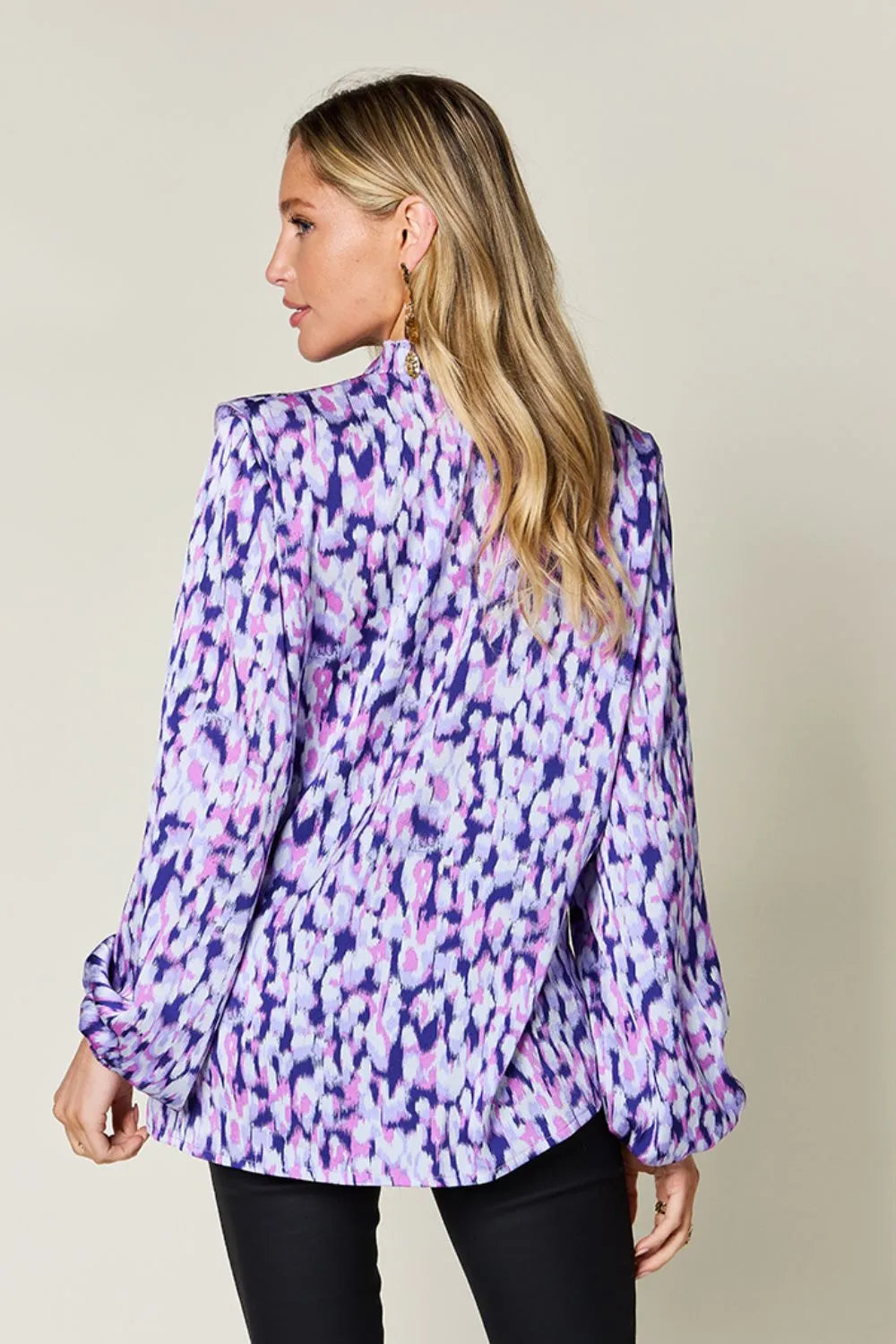 Purple printed balloon-sleeve shirt with ruffle trim at neckline, side view
