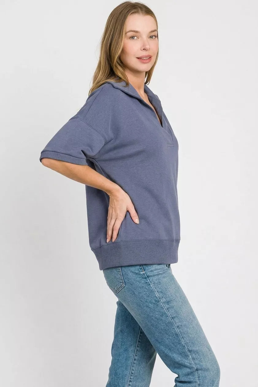 Blue indigo scuba collared short-sleeve pullover with side hem band and V placket