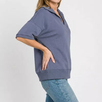 Blue indigo scuba collared short-sleeve pullover with side hem band and V placket