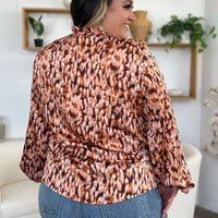 Caramel printed balloon-sleeve tunic shirt from back with gathered ruffle trim