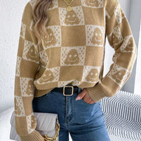 Beige round-neck pullover sweater with checkered ghost pattern, long sleeves
