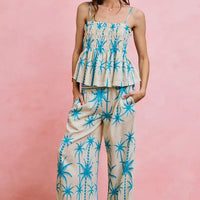 Blue palm-print smocked cami top with adjustable straps and tiered peplum hem