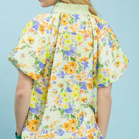 Green watercolor floral peasant blouse with gathered back yoke and short flutter sleeves