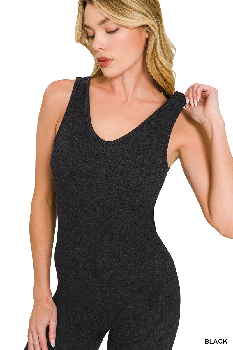 Black padded sports seamless bodysuit close-up, scoop neckline with smooth stretch fabric