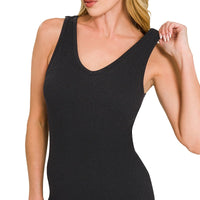 Black padded sports seamless bodysuit close-up, scoop neckline with smooth stretch fabric