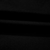 Close-up of black knit fabric with soft matte texture