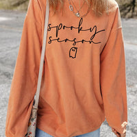 Orange ribbed pullover sweatshirt with spooky “sprooky season” text and ghost graphic