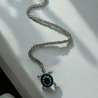 Silver chain turtle pendant necklace with dark blue enamel turtle shell