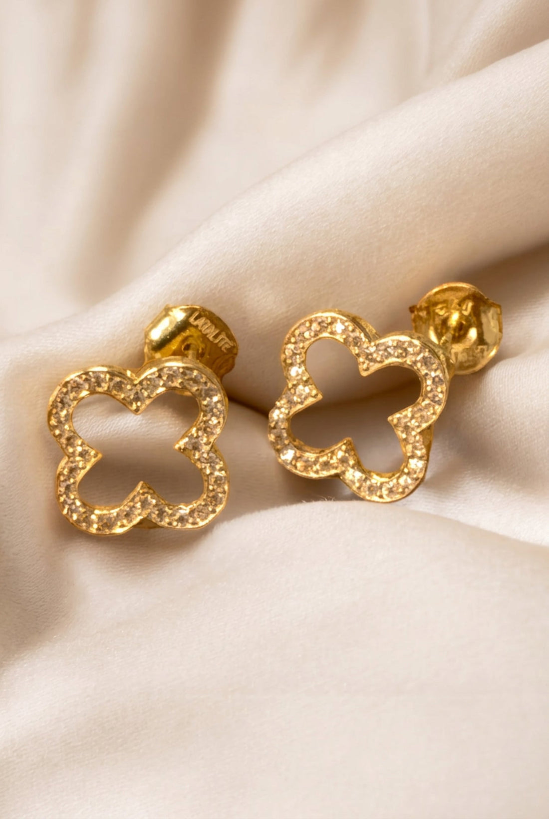 Gold open clover earrings with textured outline
