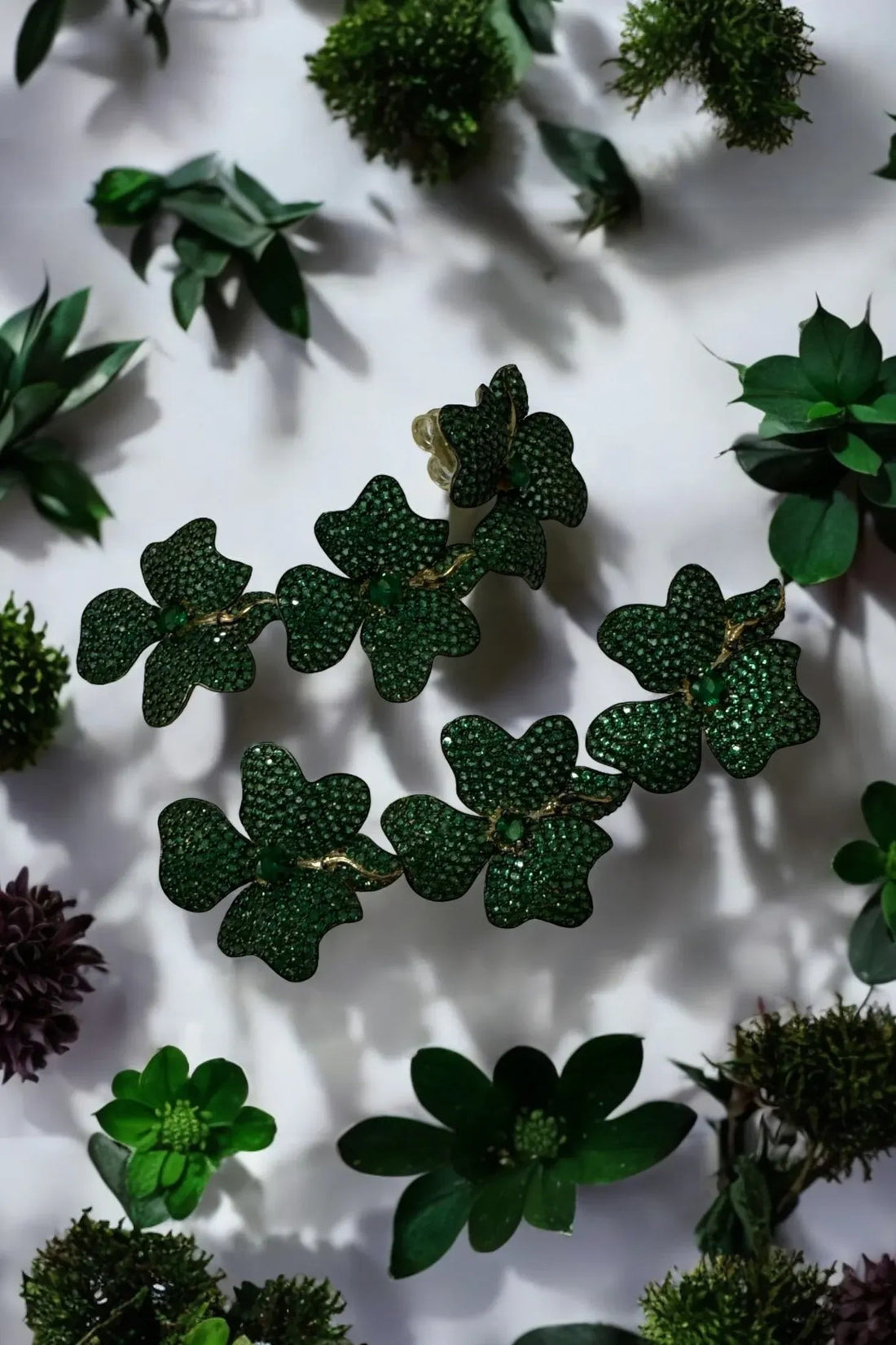 Triple drop green flower earrings, gold-tone details, close-up of textured petals