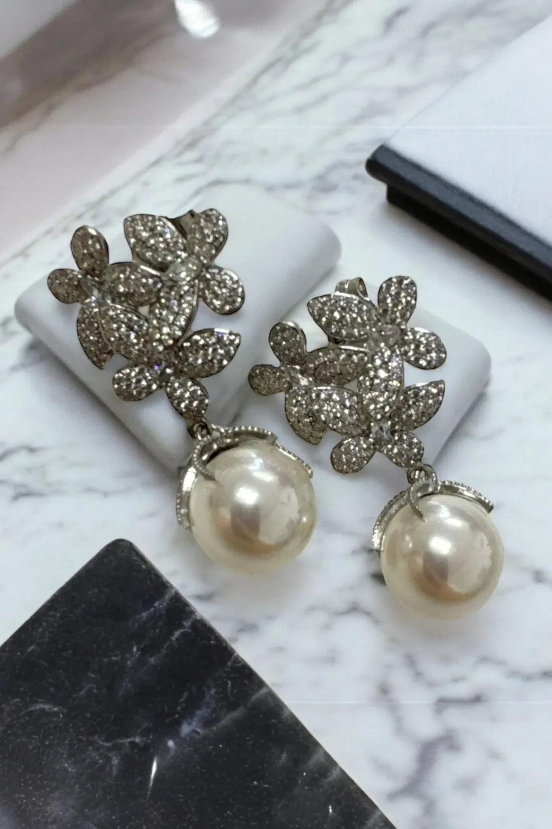 Crystal flower cluster earrings with white pearl drops, silver-toned
