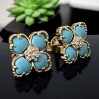 Gold-tone clover turquoise stud earrings with crystal flower center