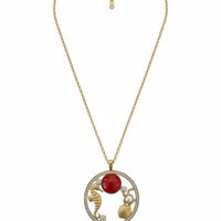 Gold-tone seashell pendant necklace with red coral bead and circular charm
