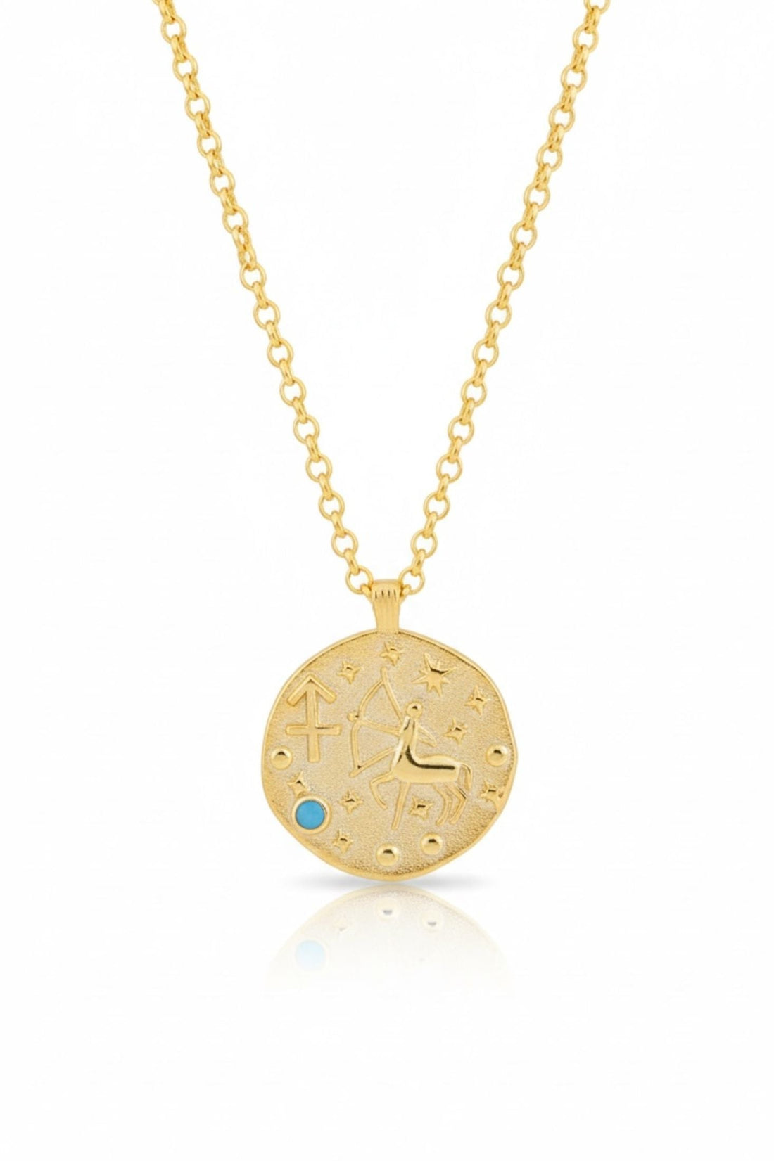 Gold zodiac talisman necklace with round pendant and blue birthstone accents