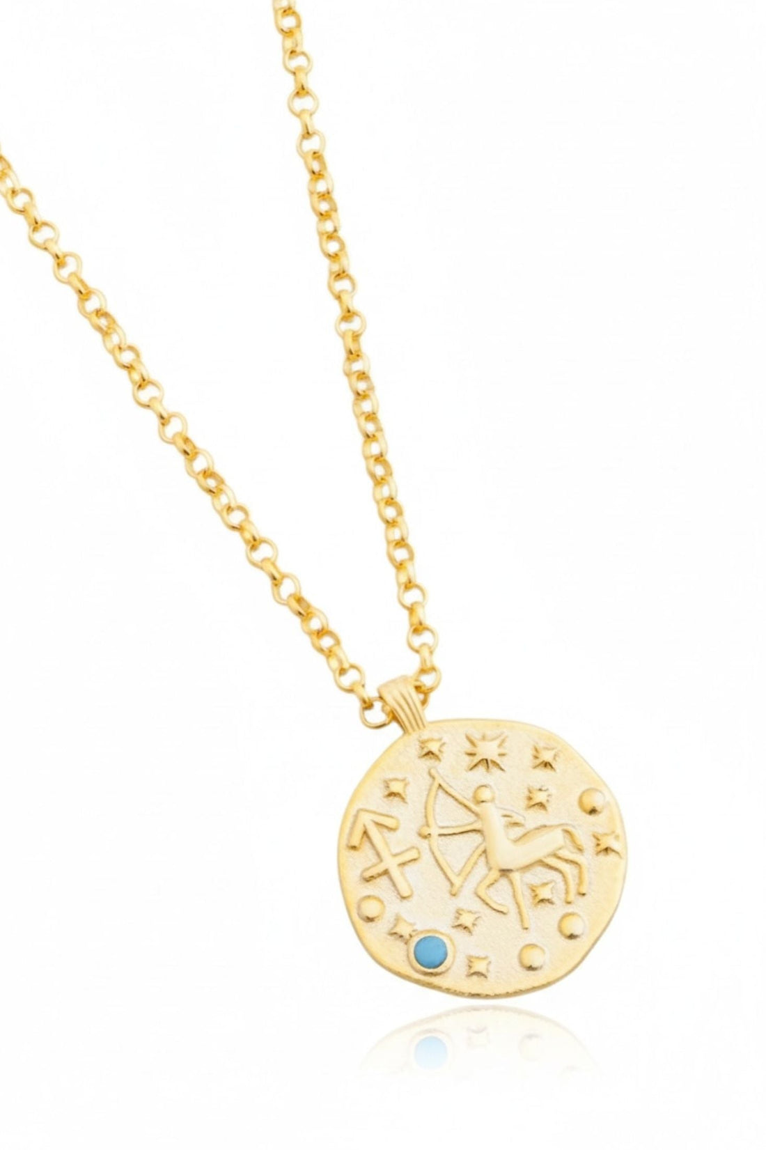 Gold zodiac talisman necklace with round pendant and blue accent stone