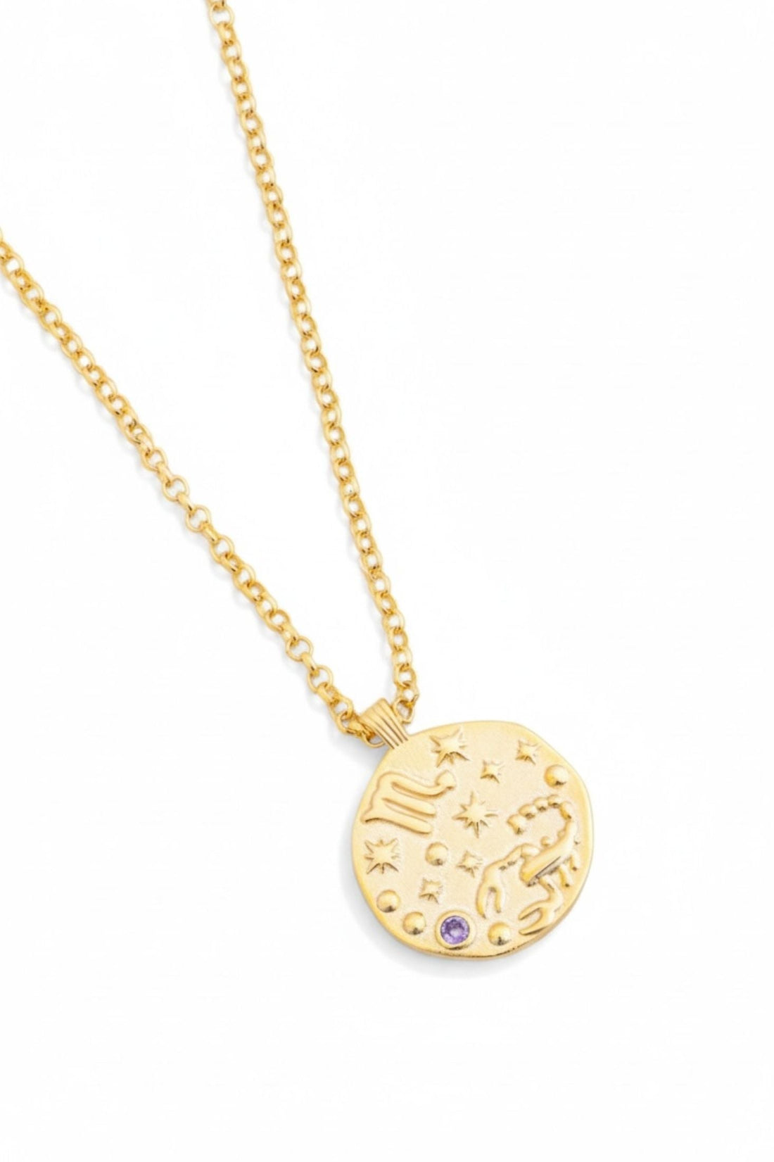 Gold round pendant necklace with zodiac design and blue birthstone charm