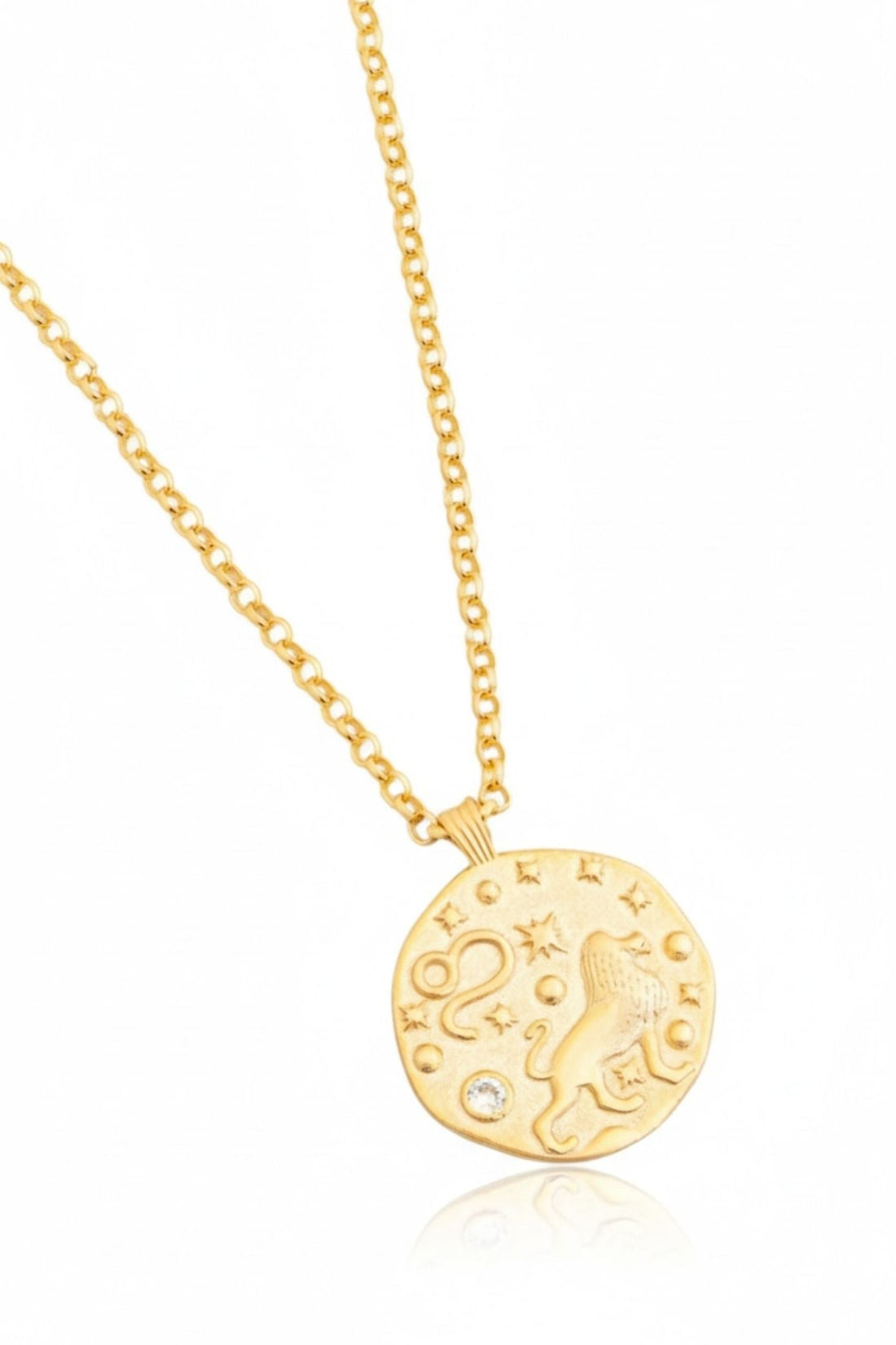 Gold-tone round Leo zodiac pendant necklace, close-up with chain links