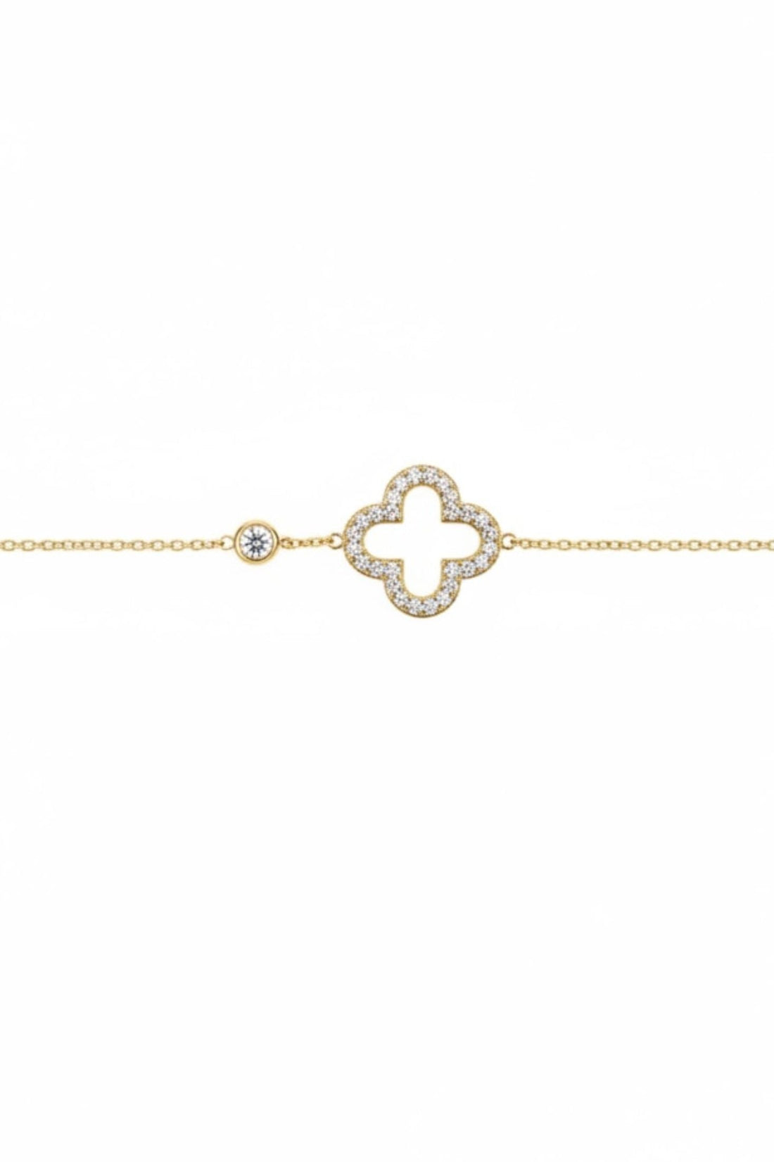 Gold bracelet with open clover charm and small round accents