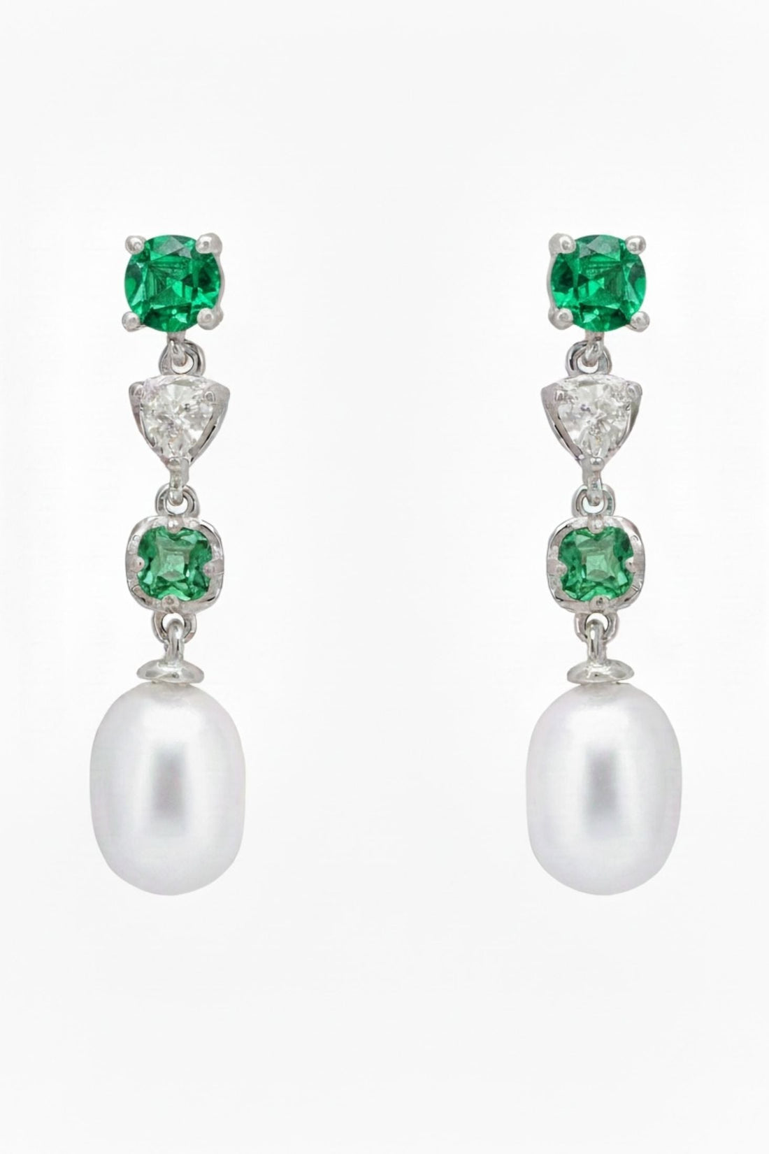 Silver drop earrings with green emerald stones and white pearl dangles