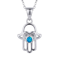 Silver hamsa hand pendant necklace with blue opal-style round center charm