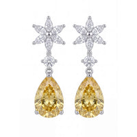 Silver drop earrings with yellow pear gemstones and crystal flower accents
