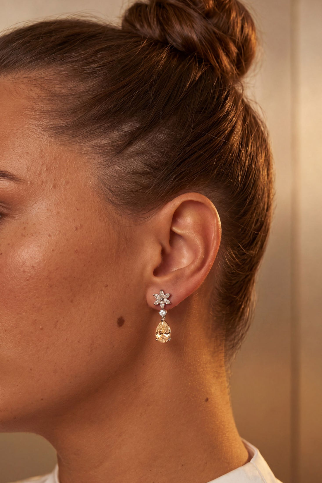 Silver drop earrings with crystal flower tops and yellow teardrop dangle gemstones