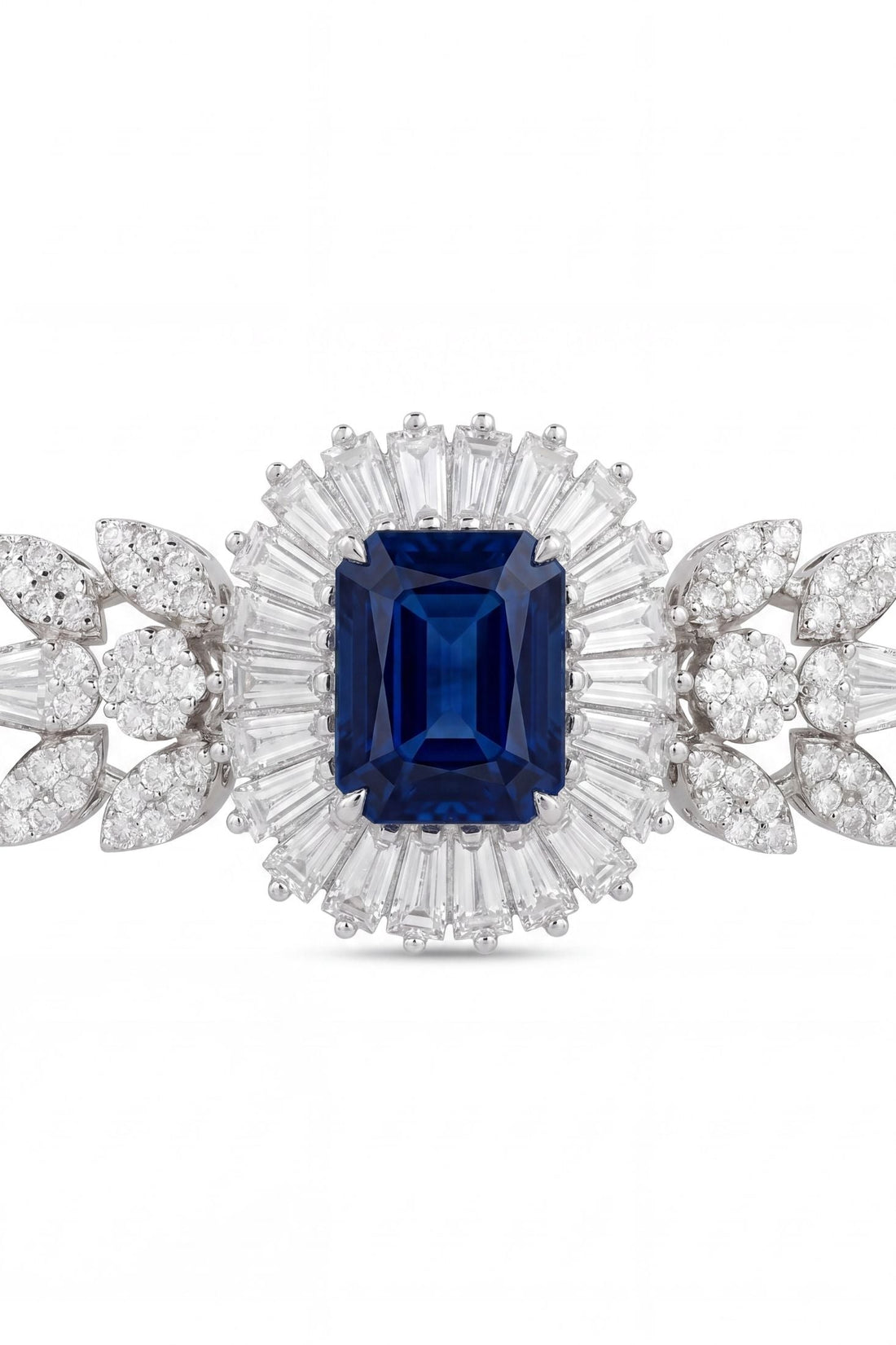 Silver bracelet with large blue sapphire cushion surrounded by clear stones