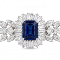 Silver bracelet with large blue sapphire cushion surrounded by clear stones
