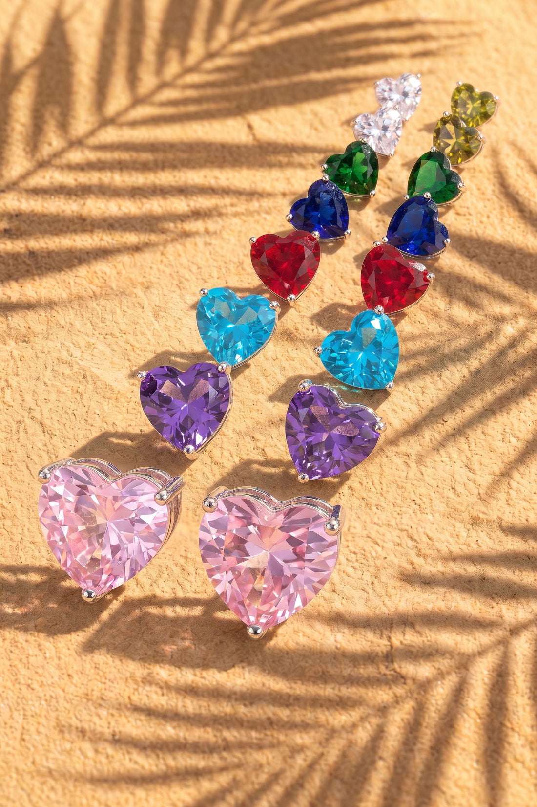 Heart stud earrings with assorted colorful faceted gemstones arranged