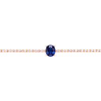 Garbo oval sapphire tennis bracelet in gold with a central blue gemstone