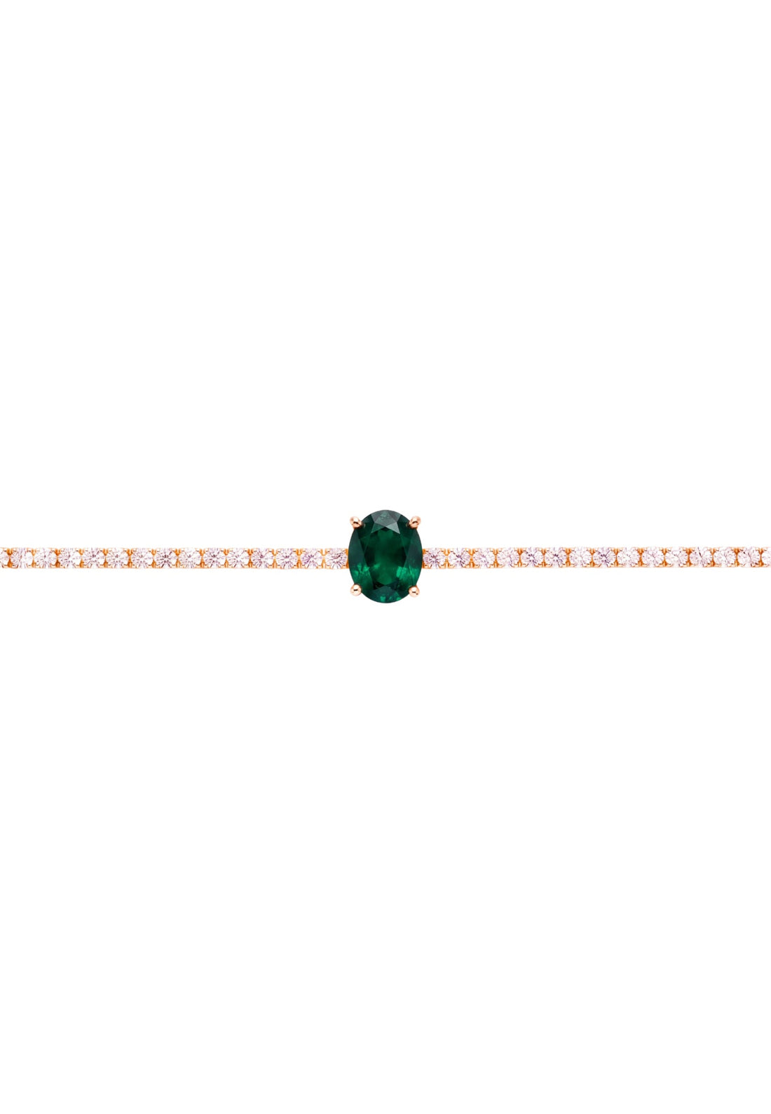 Gold tennis bracelet with oval emerald center stone