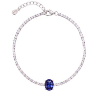 Silver tennis bracelet with oval sapphire gemstone centerpiece