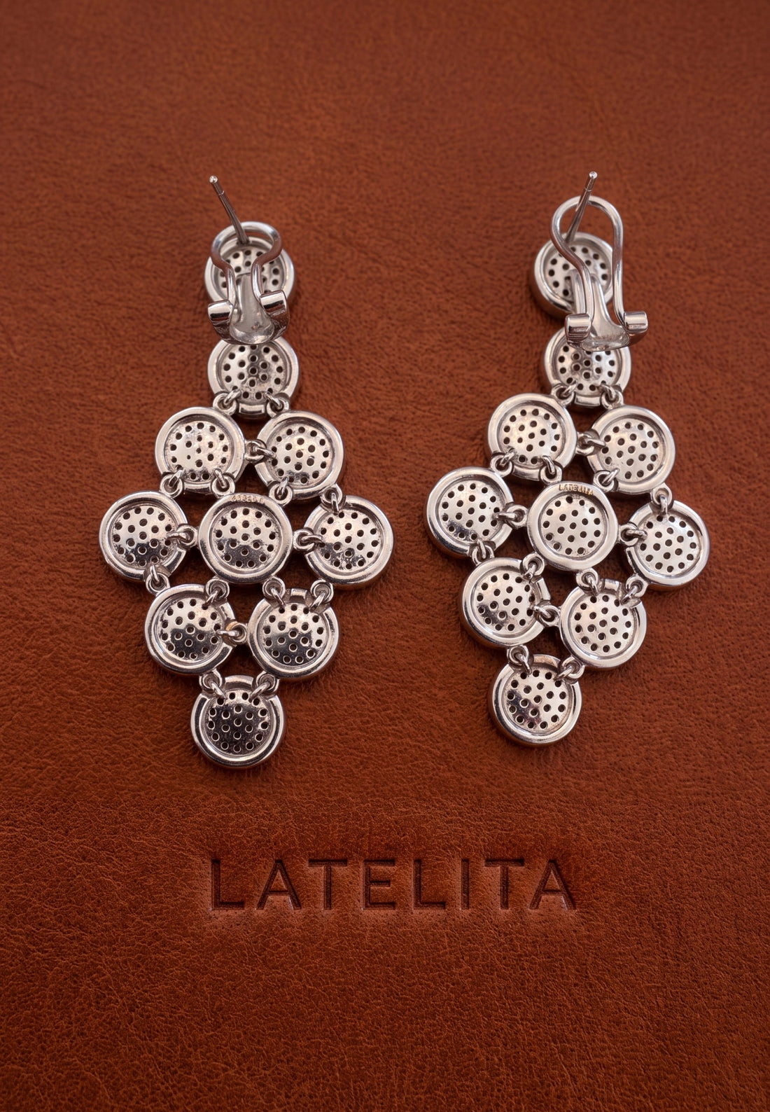 Silver cascading disc drop earrings with perforated circular links