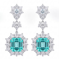 Silver drop earrings with teal aquamarine square stones and clear crystal halos