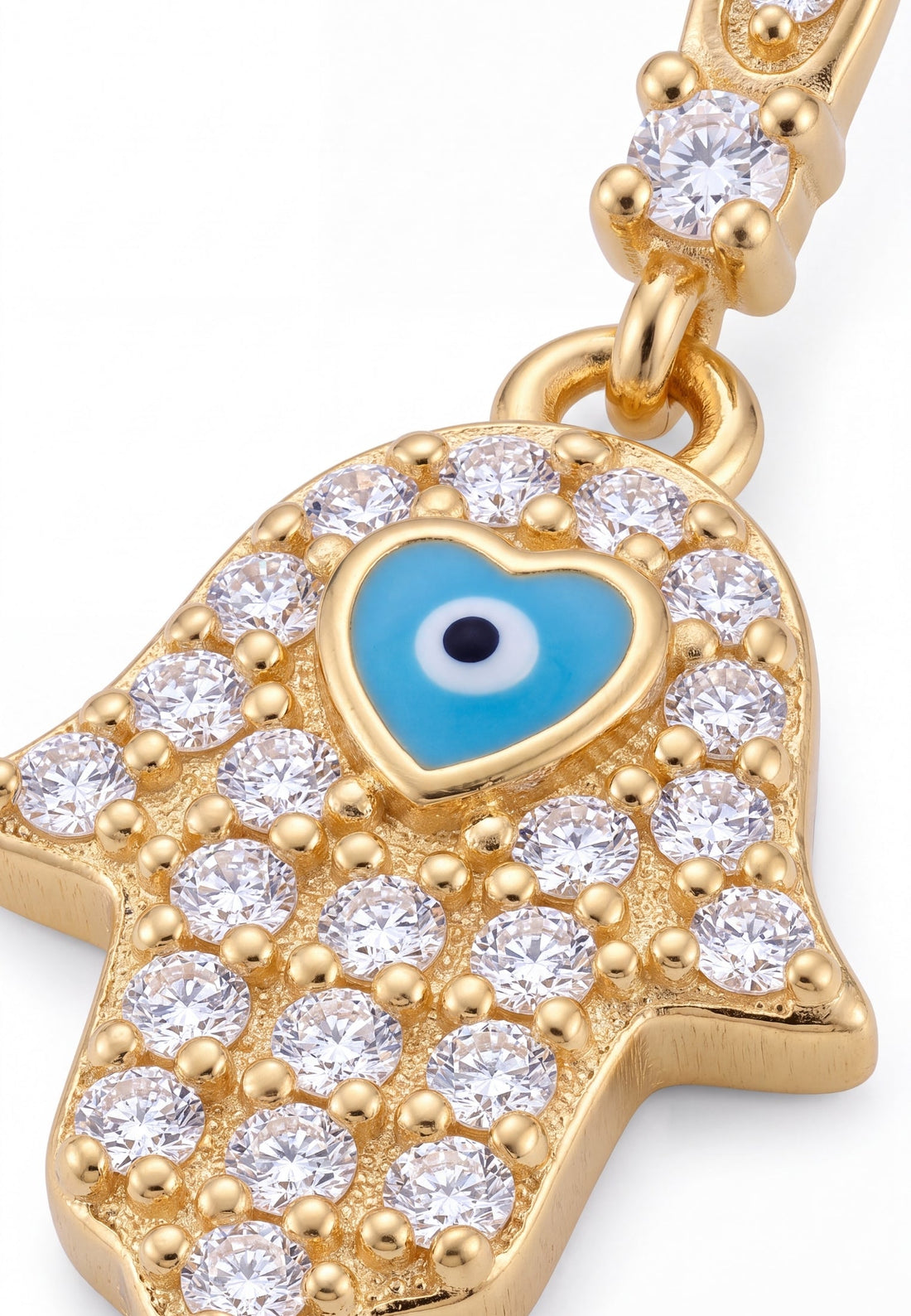 Close-up gold hamsa hand charm with blue eye enamel and clear rhinestones