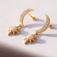 Gold crescent moon and starburst opal drop earrings