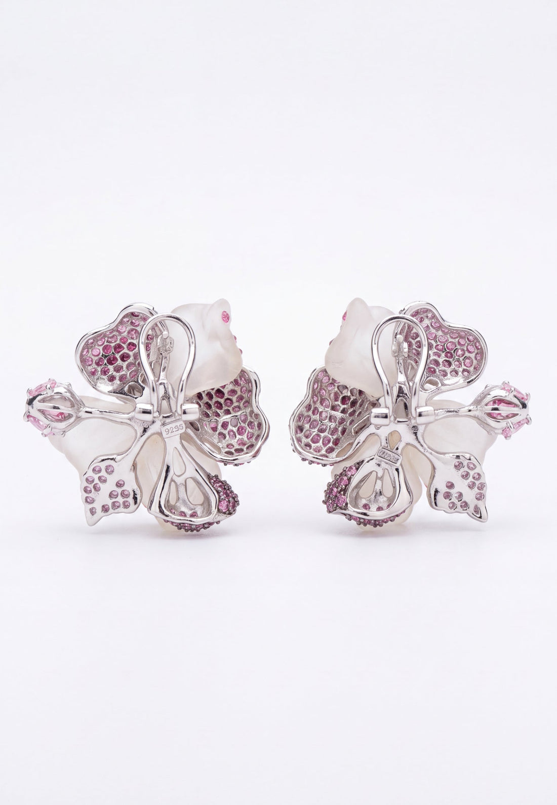 Silver-tone flower stud earrings with butterfly backs and pink rhinestone petal detail