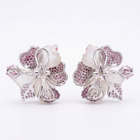 Silver-tone flower stud earrings with butterfly backs and pink rhinestone petal detail