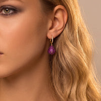 Gold hoop earrings with ruby pear-drop gemstone pendant