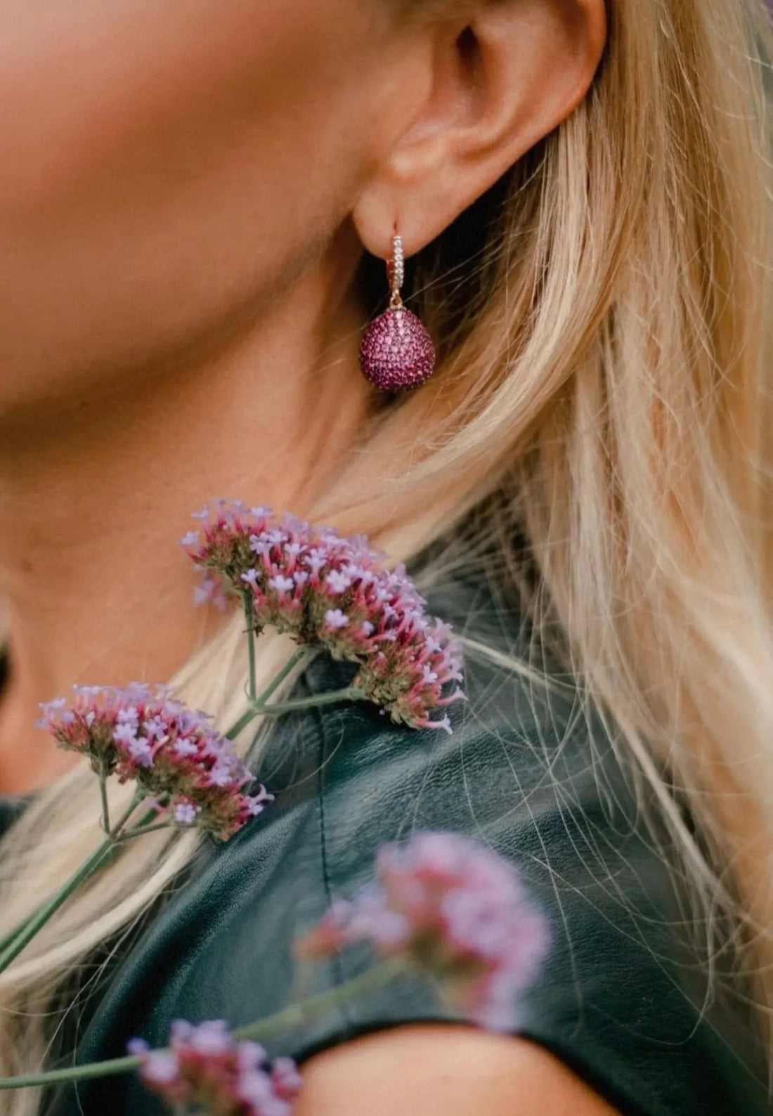 Gold pear drop gemstone earring with ruby-colored teardrop stone