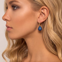 Pear drop gemstone earrings with gold hooks and sapphire blue stones