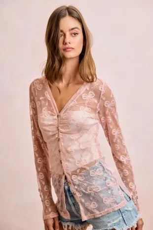 Dusty rose V-neck button mesh cardigan with bow-pattern print and long sleeves, worn open