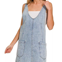 Light wash denim overall dress with square neckline and front pocket detailing