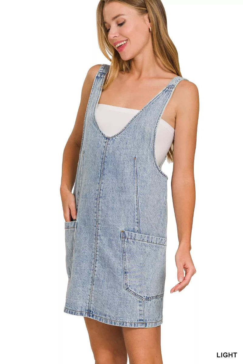 Light wash denim overall dress with side pocket and adjustable shoulder straps